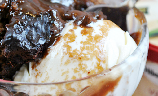 This Hot Fudge Cake is a Sunday night favorite at our house! It's the hot fudge and the cake all prepared and baked in the same dish, and it comes out all ooey, gooey, and delicious. www.somethingswanky.com