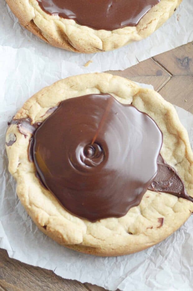 Be the hero of your tailgating parties this weekend! Bake my Quick & Easy Chocolate Chip Cookie recipe into 2 round cake pans, make a quick cut in the middle plus frosting, and voila! A football cookie cake in no time. 