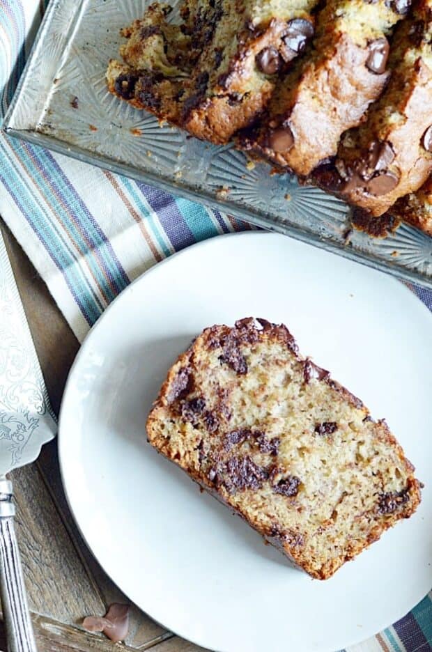 My mom's banana bread is full of chocolate chips and is SUPER soft and moist thanks to 4 whole bananas and a little bit of oil. It's the best!