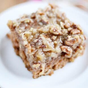 This Oatmeal Cake is serious comfort food. Something about that caramel coconut pecan topping soaking into the warm cake is just so irresistible!