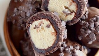 Cookie dough wrapped in a brownie and covered in chocolate. These Cookie Dough Brownie Bombs are even better than they look!