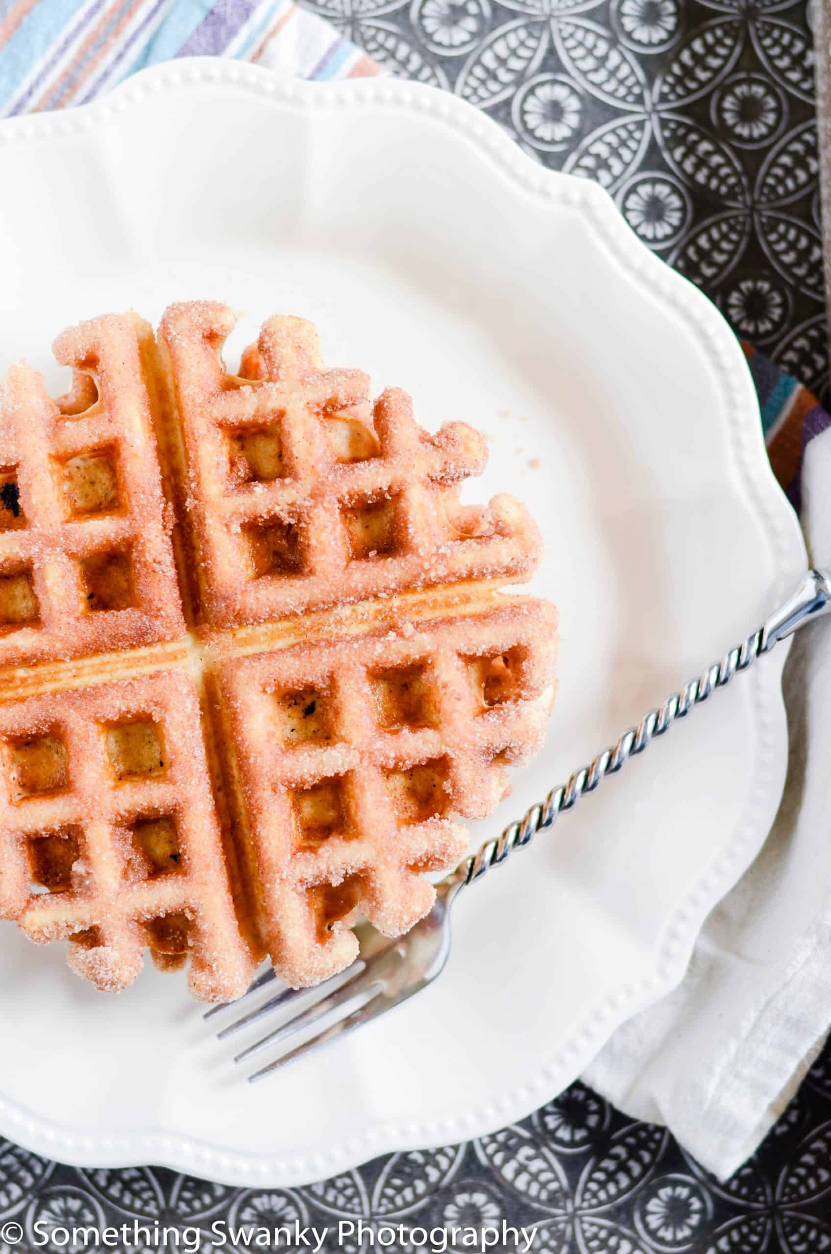 These waffles are so easy to make and absolutely melt-in-your-mouth incredible. My favorite Belgian Waffles dipped in butter and coated in cinnamon sugar.