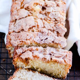 Deliciously moist banana bread with a cinnamon swirl in the middle and a crispy cinnamon sugar coating on the outside.