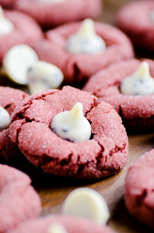 Red velvet cookies made entirely from scratch (no cake mix!) topped with Cookies & Cream Hershey Kisses!