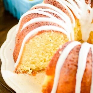 A recipe for homemade lemon poppyseed pound cake infused with a lemony simple syrup and topped with a lemon glaze.