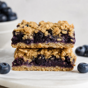 These blueberry oatmeal bars are crumbly, jammy & loaded with real blueberries! A dreamy healthy breakfast treat you'll make on repeat! 🫐