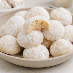 Try this classic butterball cookie recipe! Buttery, melt-in-your-mouth pecan snowballs rolled in powdered sugar — your new holiday tradition! 🍪