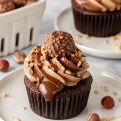 These All-the-Way Nutella Cupcakes have Nutella in the batter, filling, AND frosting. Total dream cupcake — you HAVE to make these! 🍫