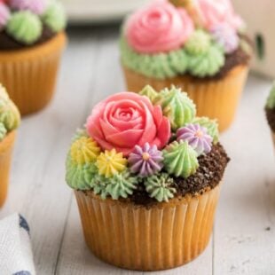 These Flower Patch Cupcakes are the cutest spring treat ever! 🌸 Chocolate crumb soil, paper blooms, and zero fancy skills needed!