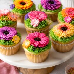 These Flower Patch Cupcakes are the cutest spring treat ever! 🌸 Chocolate crumb soil, paper blooms, and zero fancy skills needed!
