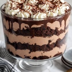 Try grandma's famous chocolate trifle recipe! Layers of cake, pudding, Cool Whip & Heath bits make this dreamy dessert totally irresistible. 😍