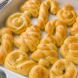 These Christmas shaped rolls are SO fun and festive! Use a cookie cutter to make adorable holiday dinner rolls everyone will love. 🎄