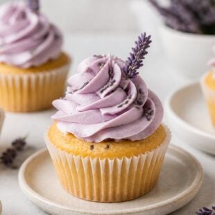 This dreamy lavender cupcake recipe has a tender crumb & honey lemon frosting. So easy & absolutely delicious — you HAVE to make these! 💜