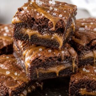 These salted caramel brownies are fudgy, gooey, and SO dreamy! Make them from scratch or with a box mix — either way, you have to try them! 🍫