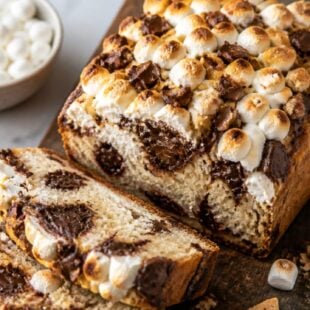 This s'mores bread is gooey, chocolaty, and absolutely dreamy! Graham crackers, marshmallows & chocolate in one irresistible loaf. 🍫🔥