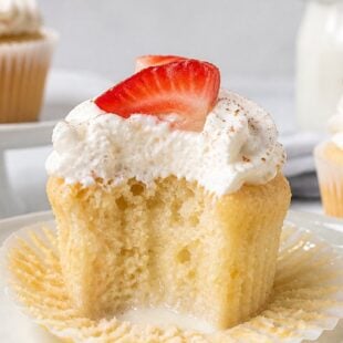 This tres leches cupcake recipe is dreamy, milk-soaked, and topped with fluffy whipped cream. You HAVE to make these! 🥥💕