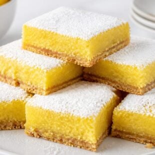 Barefoot Contessa lemon bars are buttery, creamy, and SO dreamy! Ina Garten's classic recipe is simple, foolproof, and absolutely delicious. 🍋