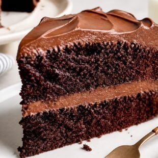This doctored chocolate cake mix is moist, fudgy & SO good! Simple swaps turn a box mix into the best cake you've ever tasted. 🍫