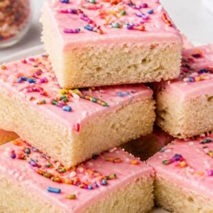 These Lofthouse Sugar Cookie Bars are soft, dreamy, and piled with fluffy frosting! So easy and absolutely delicious. You have to make these!