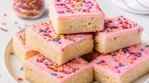 These Lofthouse Sugar Cookie Bars are soft, dreamy, and piled with fluffy frosting! So easy and absolutely delicious. You have to make these!