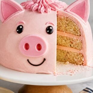 This pig cake recipe is a moist, fluffy southern classic loaded with mandarin oranges & creamy pineapple frosting. Perfect for any gathering! 🐷