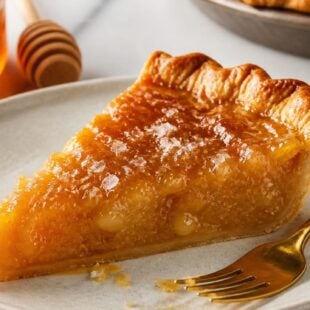 This salted honey pie is the dreamy, creamy custard pie you NEED this holiday season! Flaky crust, honey filling & flaky sea salt finish. 🍯