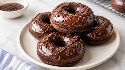 Devil's Food Cake Baked Donuts are rich, fudgy, and SO easy to make! Baked (not fried!) and dunked in a dreamy vanilla glaze. Ah-mazing!