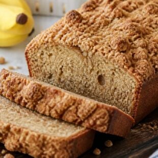 This banana bread with streusel topping is moist, dreamy, and packed with banana flavor — you absolutely have to make this ASAP! 🍌