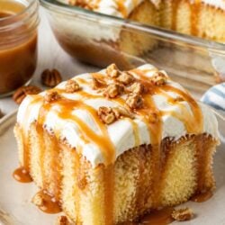 This caramel poke cake is gooey, dreamy, and SO easy to make! Yellow cake soaked in salted caramel and cheesecake pudding. You have to try it!