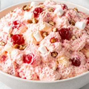 Cherry fluff salad recipe with cream cheese, marshmallows & cherry pie filling — light, fluffy, and perfect for potlucks or Sunday dinner!