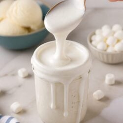 Homemade marshmallow sauce for ice cream is creamy, dreamy & SO easy to make! Just 3 ingredients for the most ah-mazing sundae topping ever! 🍦