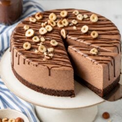 This nutella mousse cake is pure heaven! Five dreamy layers of fudgy chocolate, creamy mousse & ganache. You HAVE to make this! 🍫