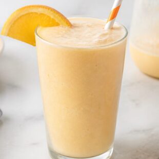 This homemade orange julius recipe tastes just like the mall classic! Creamy, frothy & ready in minutes. 🍊 You have to try it!