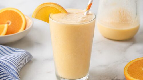 This homemade orange julius recipe tastes just like the mall classic! Creamy, frothy & ready in minutes. 🍊 You have to try it!