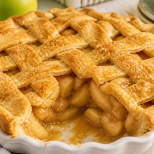 Try Paula Deen's apple pie — buttery lattice crust, gooey spiced apples & brown sugar filling. So dreamy, so delicious. You HAVE to make this! 🍎