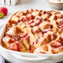 Strawberry shortcake bread pudding is the dreamy summer dessert mashup you never knew you needed — and it's SO easy to make! 🍓