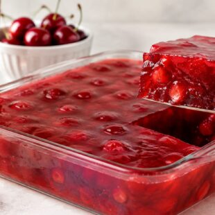 This cherry coke jello recipe is so easy, ah-mazing, and fun—just 2 ingredients! Perfect jiggly treat for parties & potlucks. Try it!