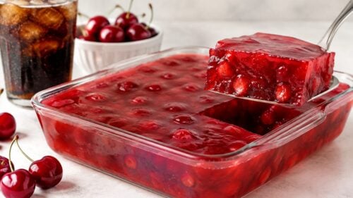 This cherry coke jello recipe is so easy, ah-mazing, and fun—just 2 ingredients! Perfect jiggly treat for parties & potlucks. Try it!