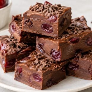 This chocolate cherry fudge recipe is gooey, fudgy, and packed with cherries + chocolate. Easy, fool proof, and totally addicting!