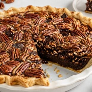 This chocolate pecan pie recipe is gooey, fudgy, and loaded with crunchy pecans — an easy, ah-mazing Thanksgiving dessert favorite!