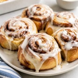 Easy Cinnabon donuts made from canned cinnamon rolls! Fried till golden, glazed till gooey — ready in 15 minutes flat. You have to make these!