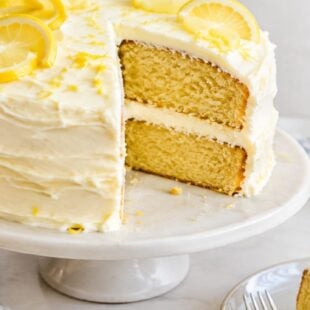 This lemon cake recipe is moist, bursting with citrus, and topped with dreamy lemon cream cheese frosting. You have to make this! 🍋
