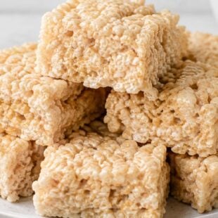 Gooey, crunchy, totally craveable — this rice krispie treats recipe loads in peanut butter, butterscotch & Butterfinger bits. Make it tonight!