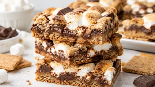 These S'mores Cookie Bars are soft, chewy, gooey, and loaded with marshmallow and chocolate. The easiest copycat dessert bar recipe ever!