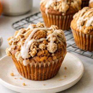 This starbucks pumpkin muffin recipe is moist, spiced, and stuffed with cream cheese filling! A fall bakery favorite made right at home.