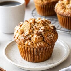 This starbucks pumpkin muffin recipe is moist, spiced, and stuffed with cream cheese filling! A fall bakery favorite made right at home.
