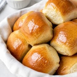 Soft, fluffy copycat Texas Roadhouse rolls recipe with honey cinnamon butter! Easy homemade dinner rolls you'll make again and again.